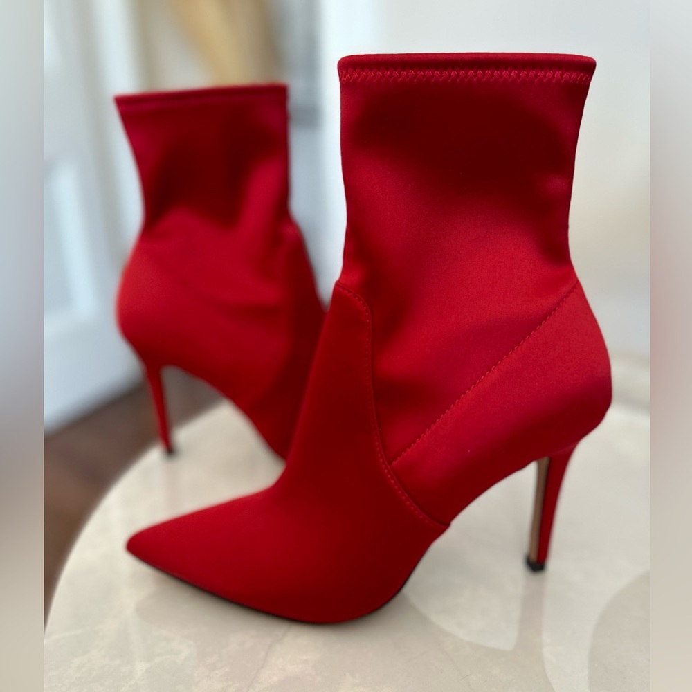 Bright red, satin booties from Aldo in a size 7.5. Never worn!